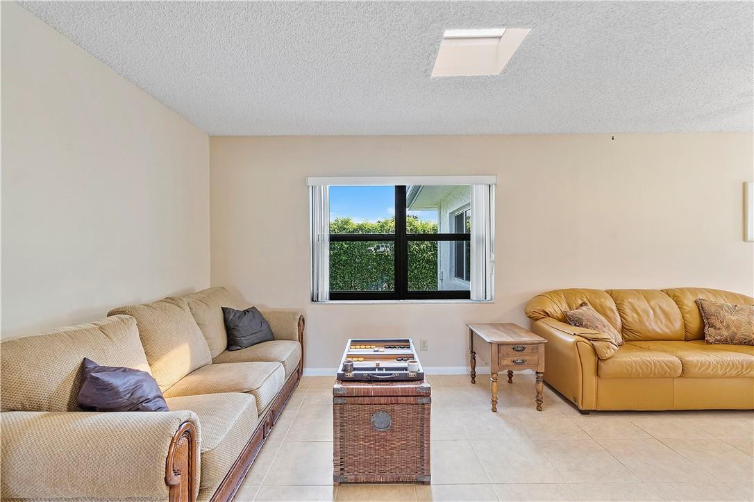 6419 Hitchin Post Way Delray Beach, FL 33484 - Photo 19 of 33 a living room with furniture and a couch