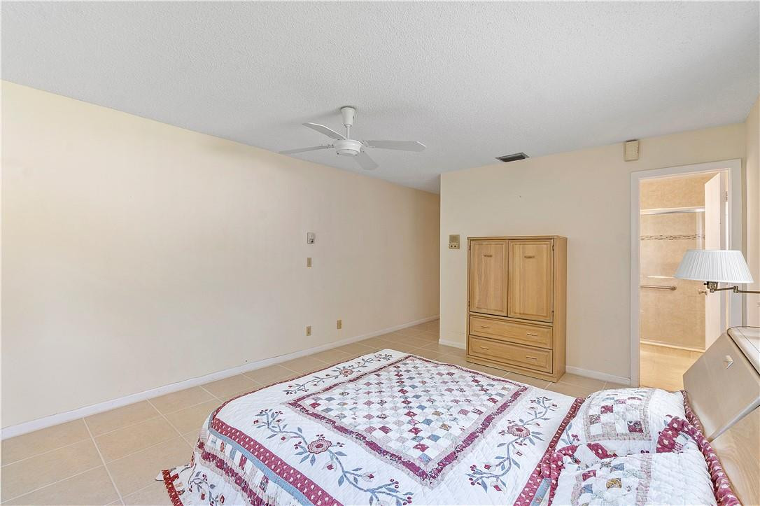 6419 Hitchin Post Way Delray Beach, FL 33484 - Photo 21 of 33 a bedroom with a bed and a dresser