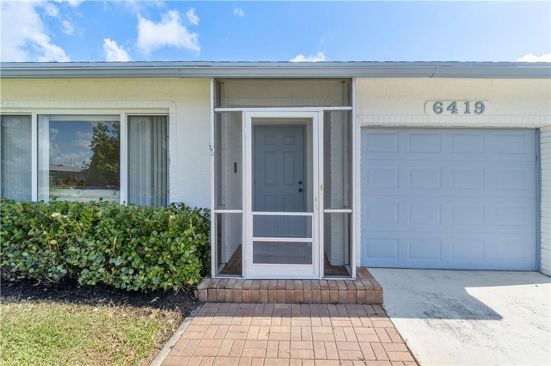 6419 Hitchin Post Way Delray Beach, FL 33484 - Photo 28 of 33 a front view of a building