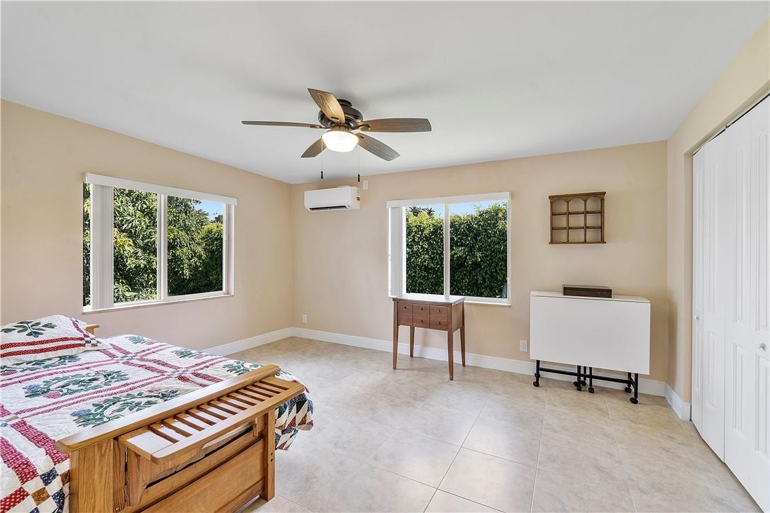 6419 Hitchin Post Way Delray Beach, FL 33484 - Photo 6 of 33 a bedroom with furniture and a window