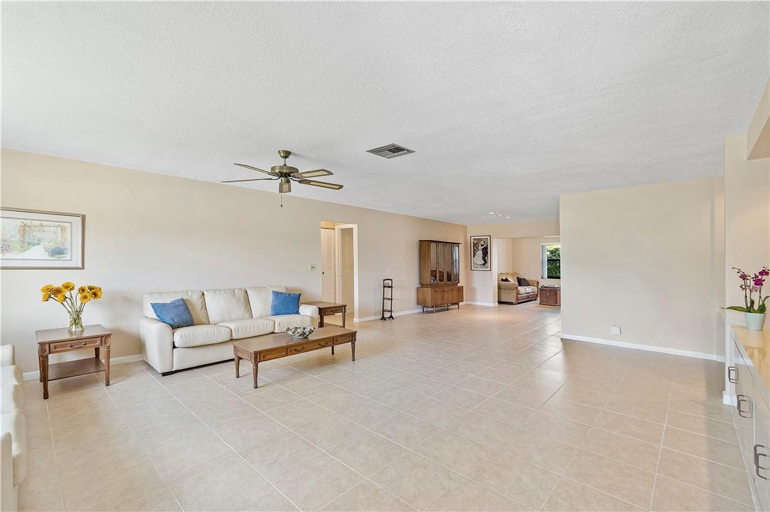 6419 Hitchin Post Way Delray Beach, FL 33484 - Photo 8 of 33 a living room with furniture and a chandelier