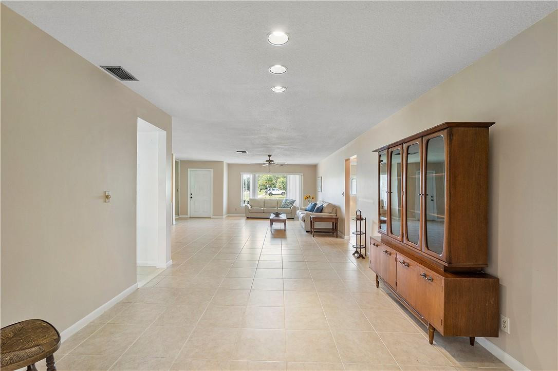 6419 Hitchin Post Way Delray Beach, FL 33484 - Photo 9 of 33 view of living room with furniture and large windows