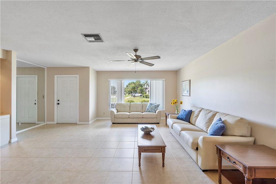 6419 Hitchin Post Way Delray Beach, FL 33484 - Photo 10 of 33 a living room with furniture and a large window