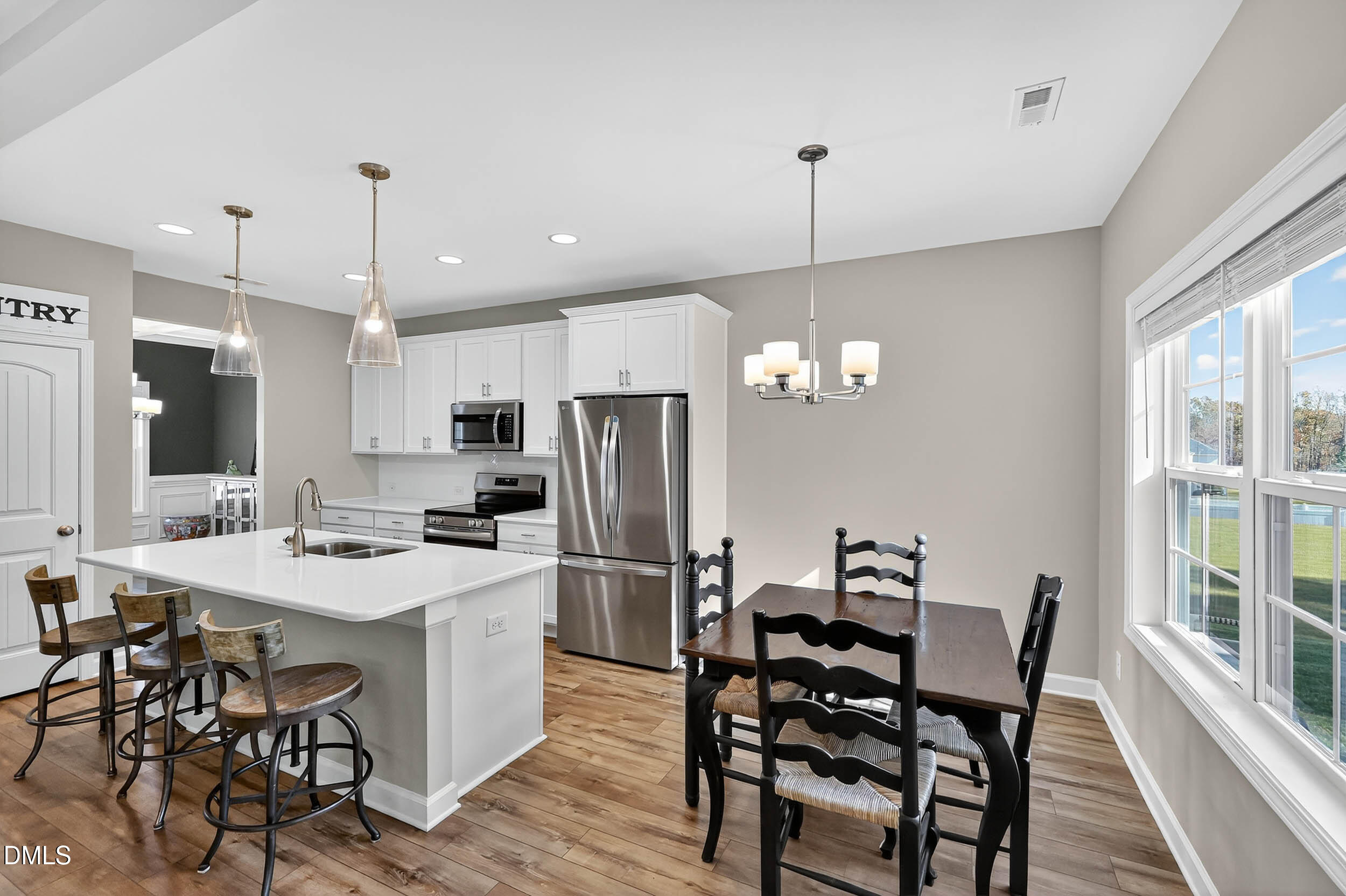 520 Husketh Road Youngsville, NC 27596 - Photo 14 of 63 a view of a dining room with furniture window and wooden floor