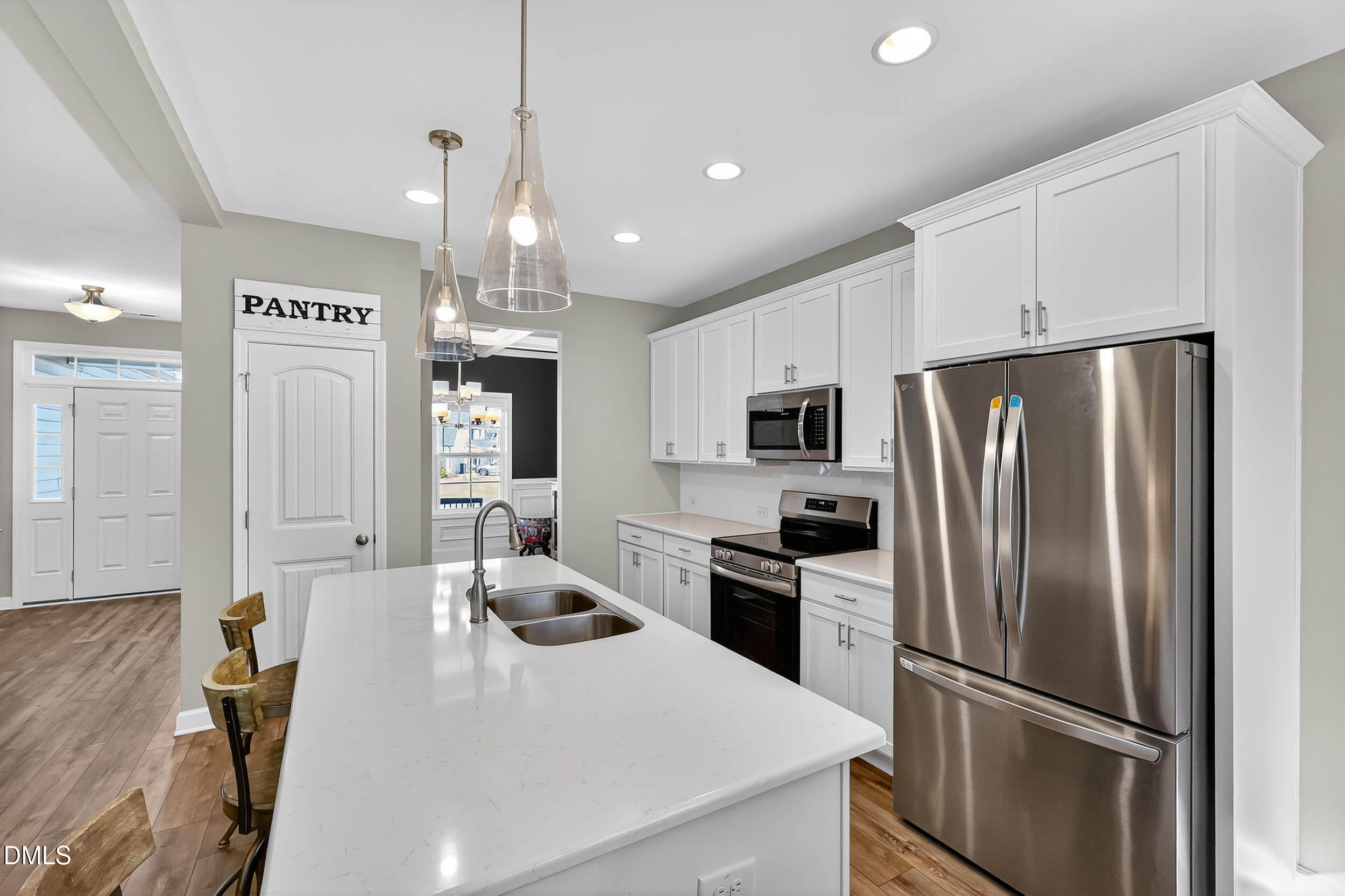 520 Husketh Road Youngsville, NC 27596 - Photo 15 of 63 a kitchen with stainless steel appliances a refrigerator sink and microwave