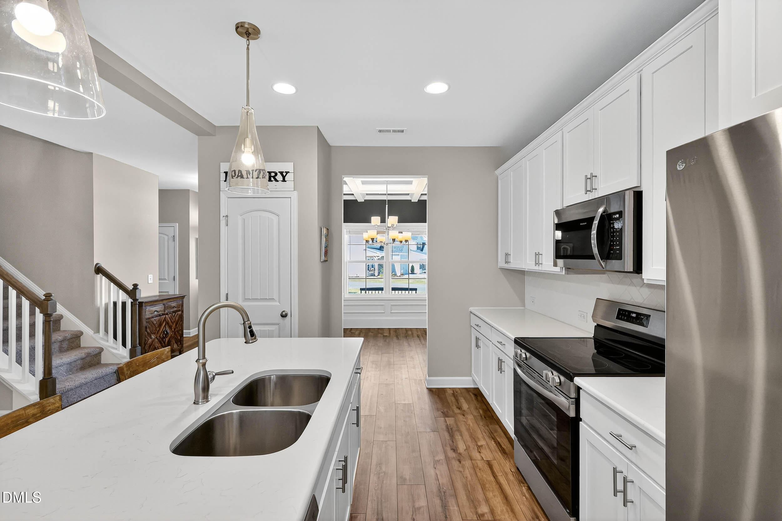 520 Husketh Road Youngsville, NC 27596 - Photo 15 of 63 a kitchen with stainless steel appliances a sink a stove a refrigerator cabinets and a oven