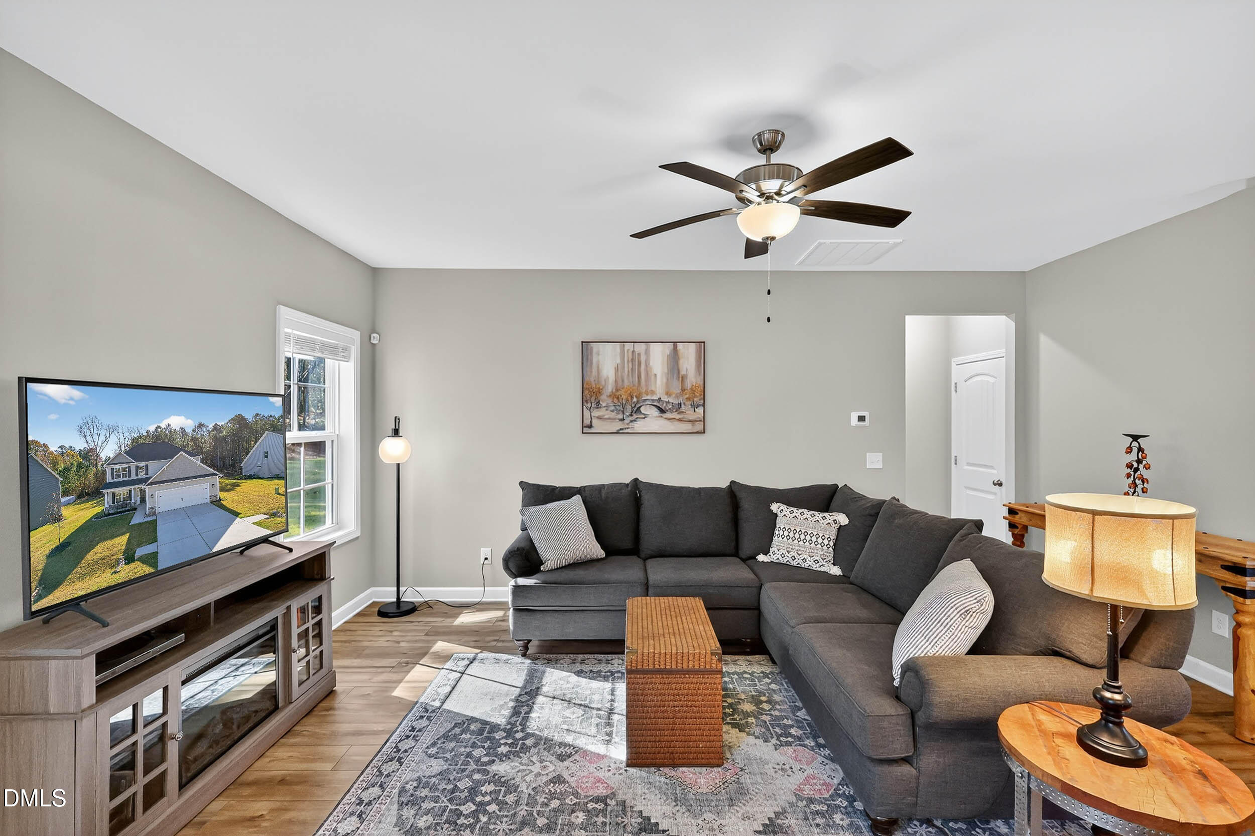 520 Husketh Road Youngsville, NC 27596 - Photo 17 of 63 a living room with furniture and a flat screen tv