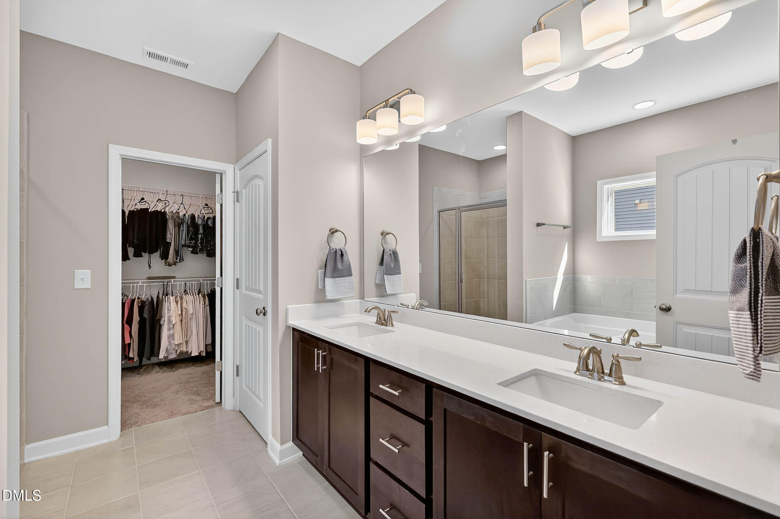 520 Husketh Road Youngsville, NC 27596 - Photo 26 of 63 a bathroom with a sink double vanity and a mirror