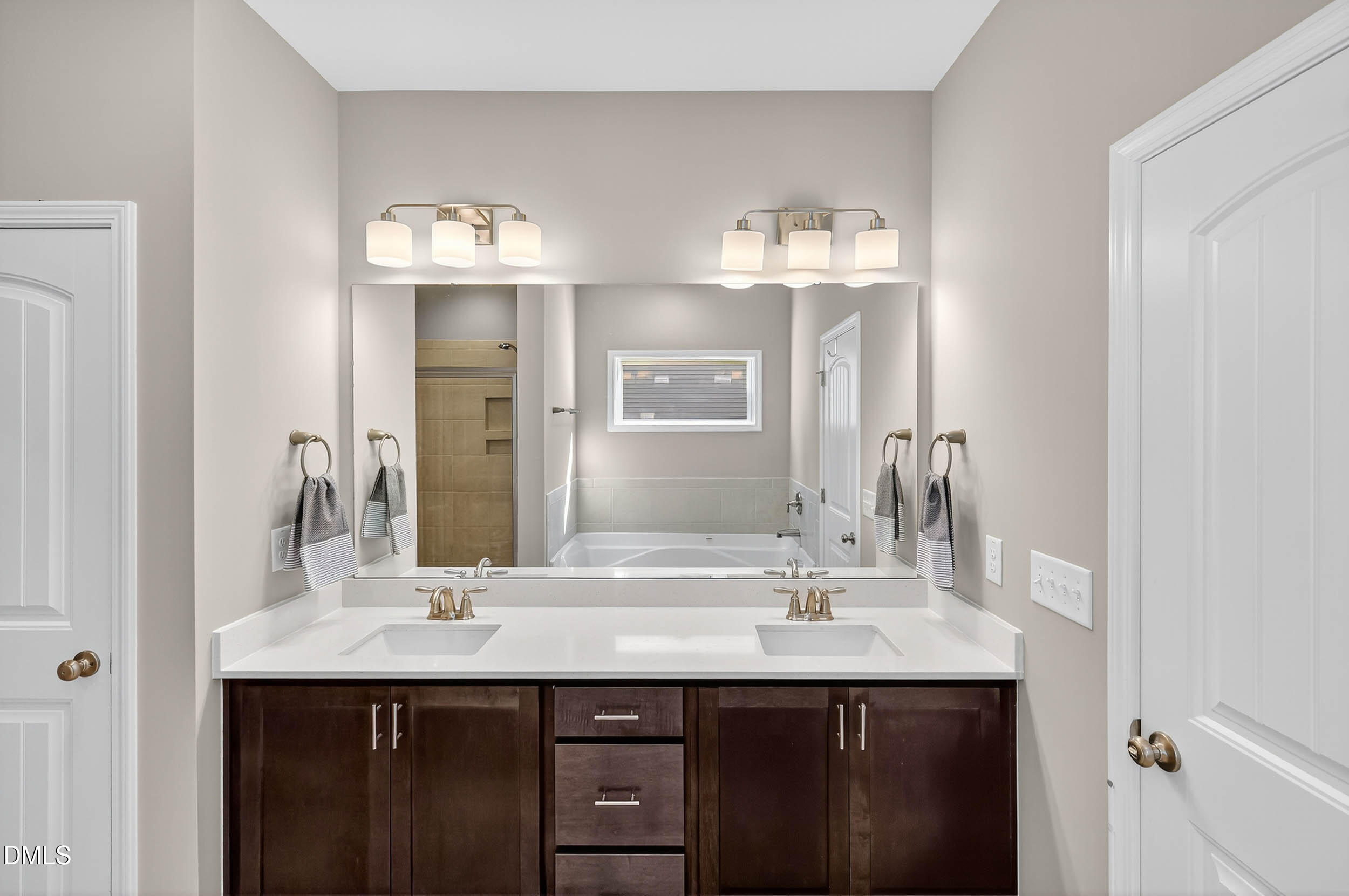 520 Husketh Road Youngsville, NC 27596 - Photo 27 of 63 a bathroom with a sink double vanity and a mirror