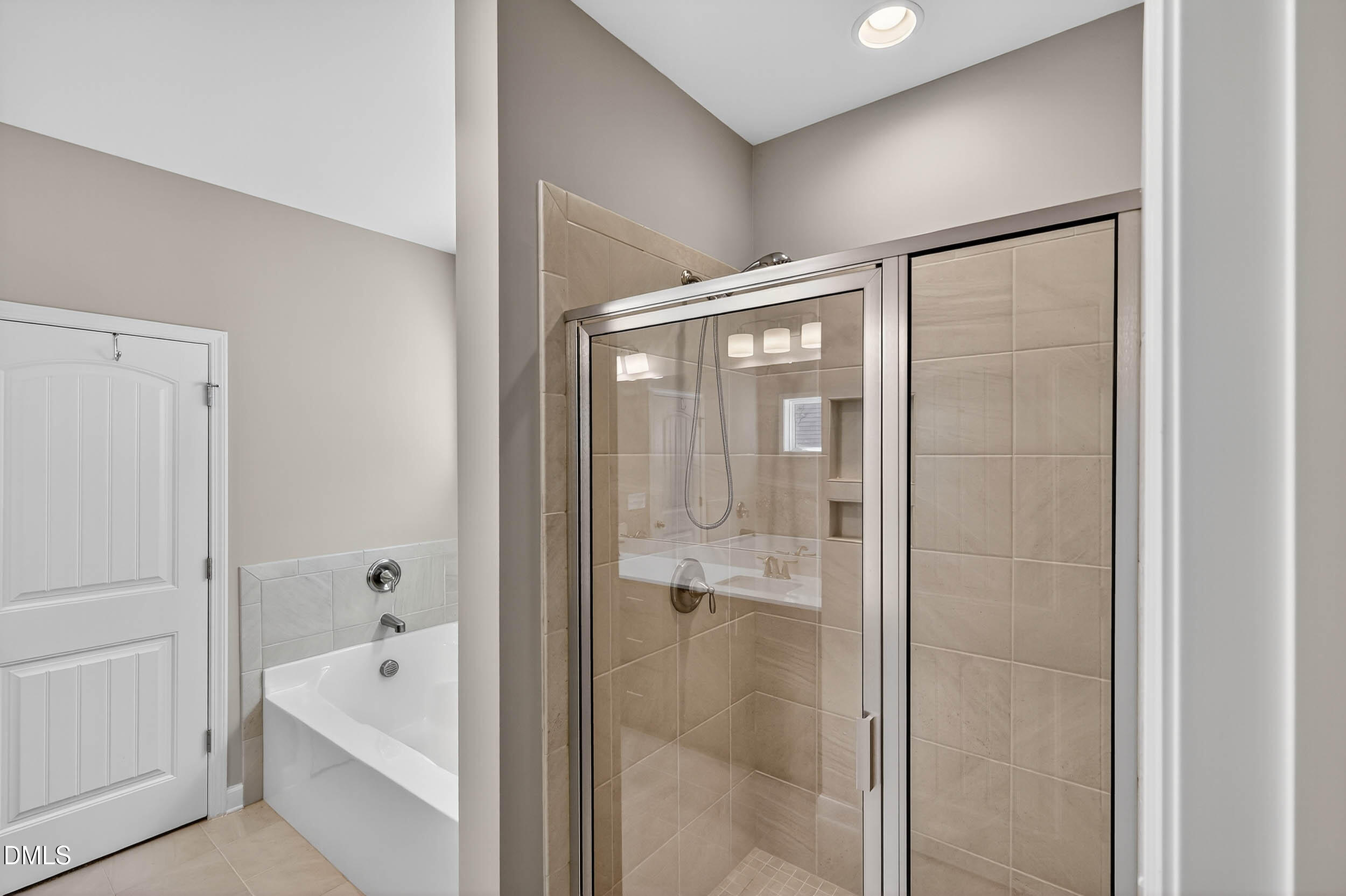 520 Husketh Road Youngsville, NC 27596 - Photo 28 of 63 a bathroom with a tub shower and a sink