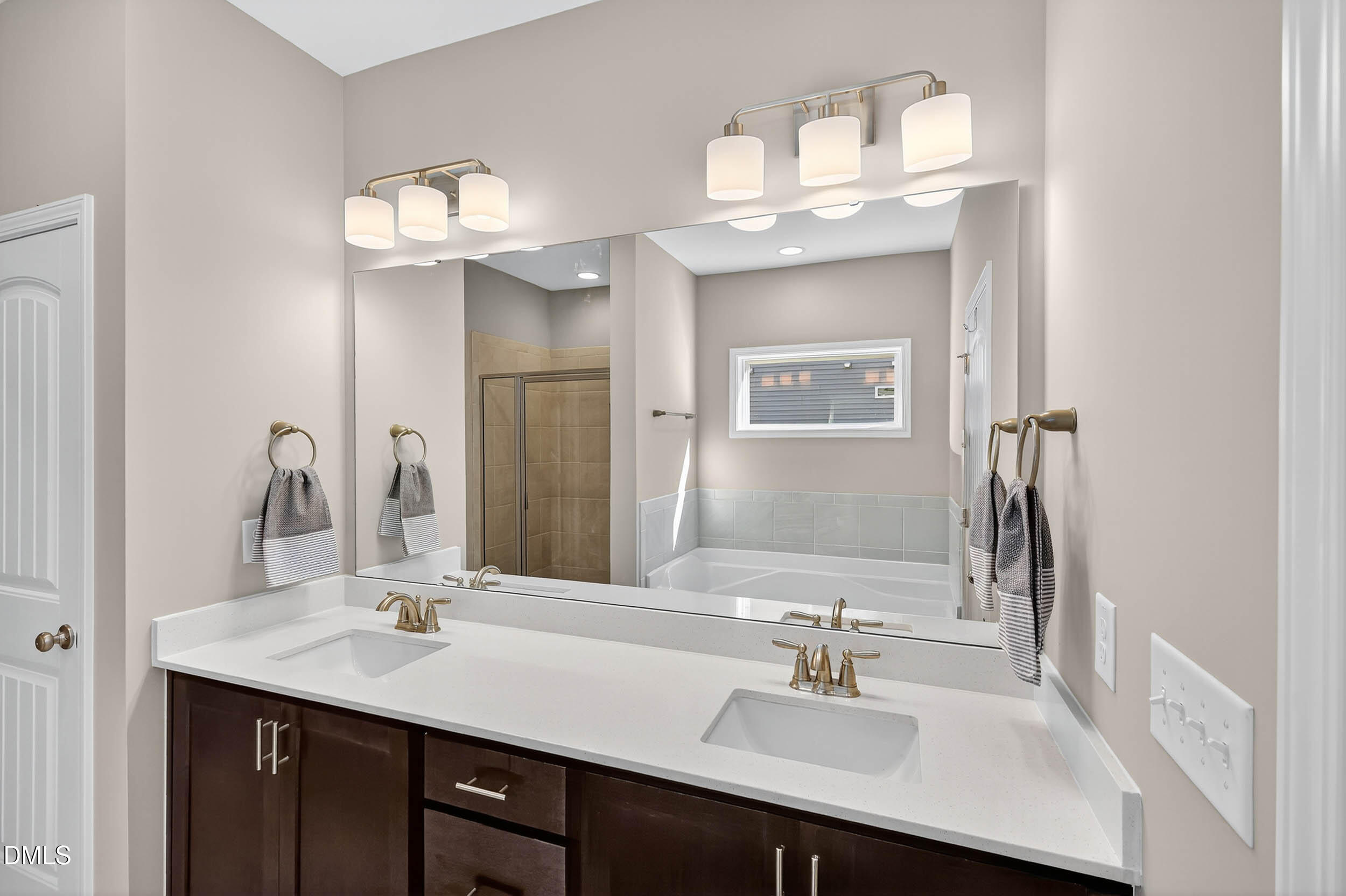 520 Husketh Road Youngsville, NC 27596 - Photo 28 of 63 a bathroom with a sink double vanity and a mirror