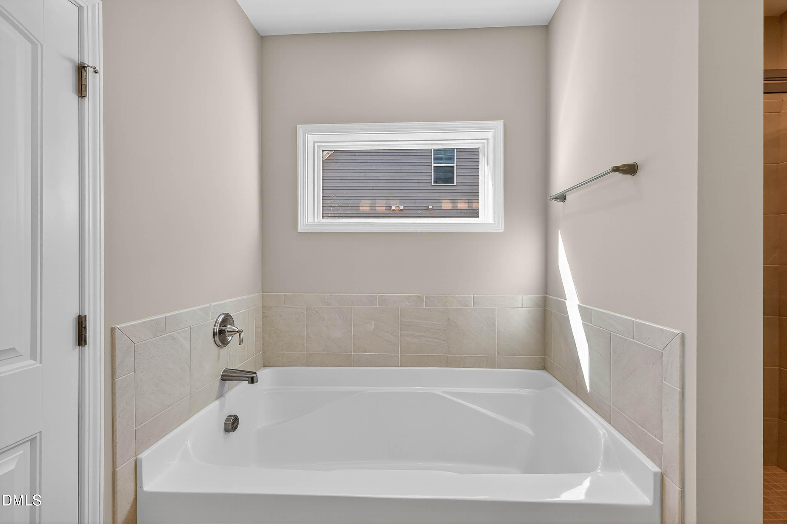 520 Husketh Road Youngsville, NC 27596 - Photo 29 of 63 a white bath tub sitting next to a white cabinet