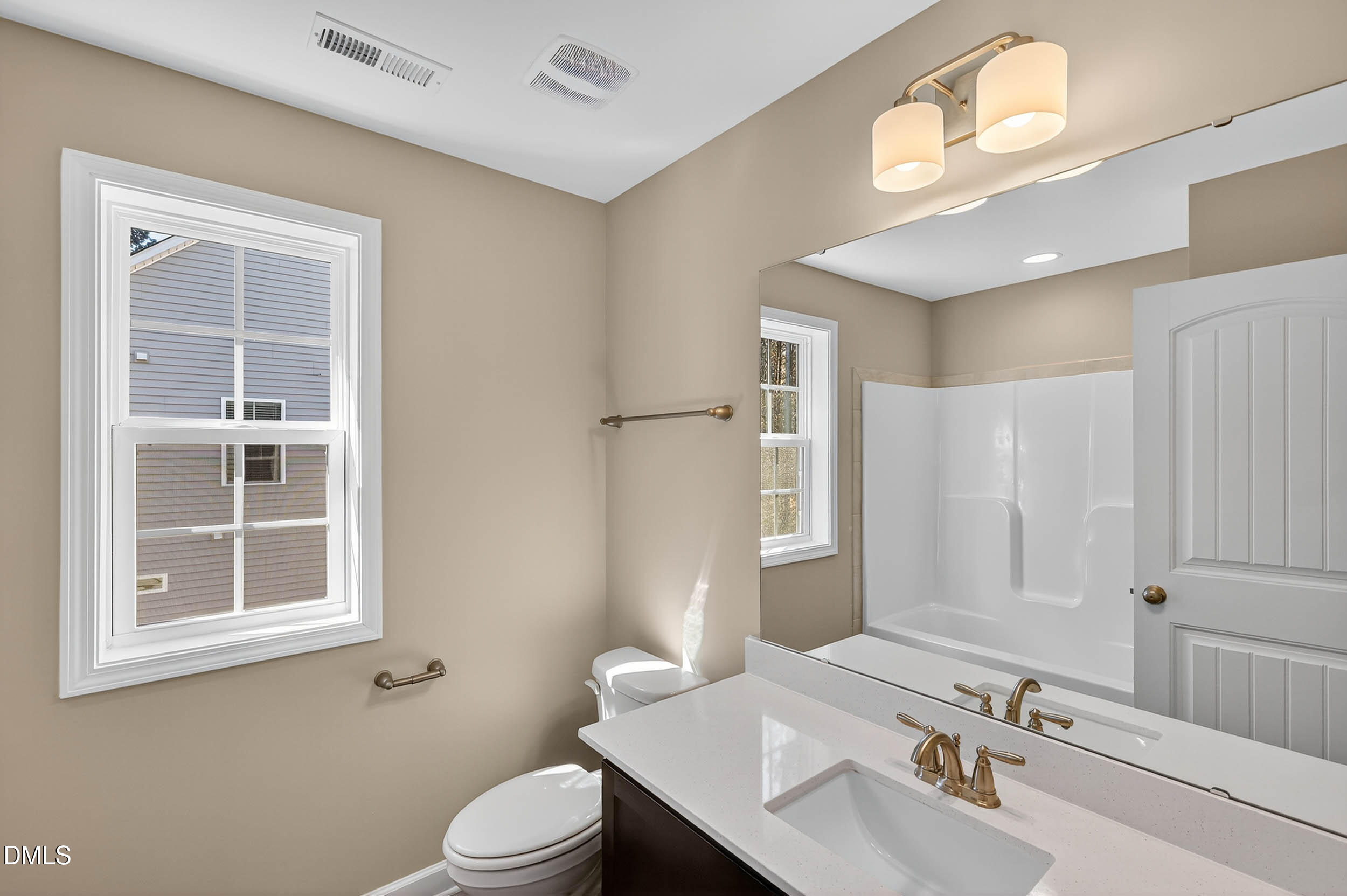 520 Husketh Road Youngsville, NC 27596 - Photo 35 of 63 a bathroom with a sink and a mirror