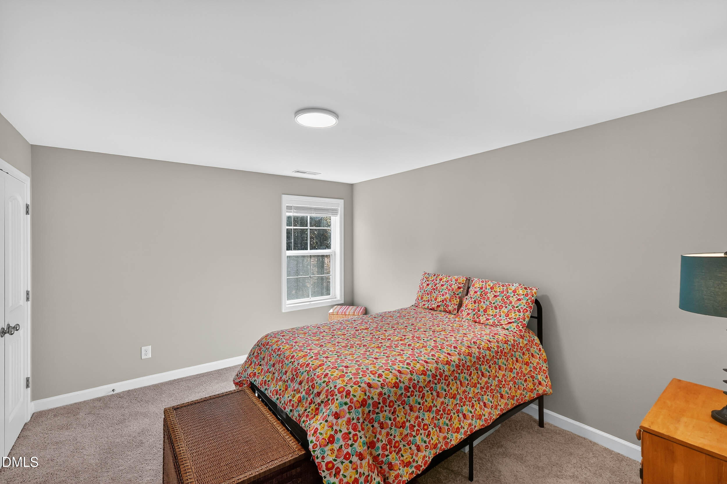 520 Husketh Road Youngsville, NC 27596 - Photo 36 of 63 a bedroom with a bed and windows