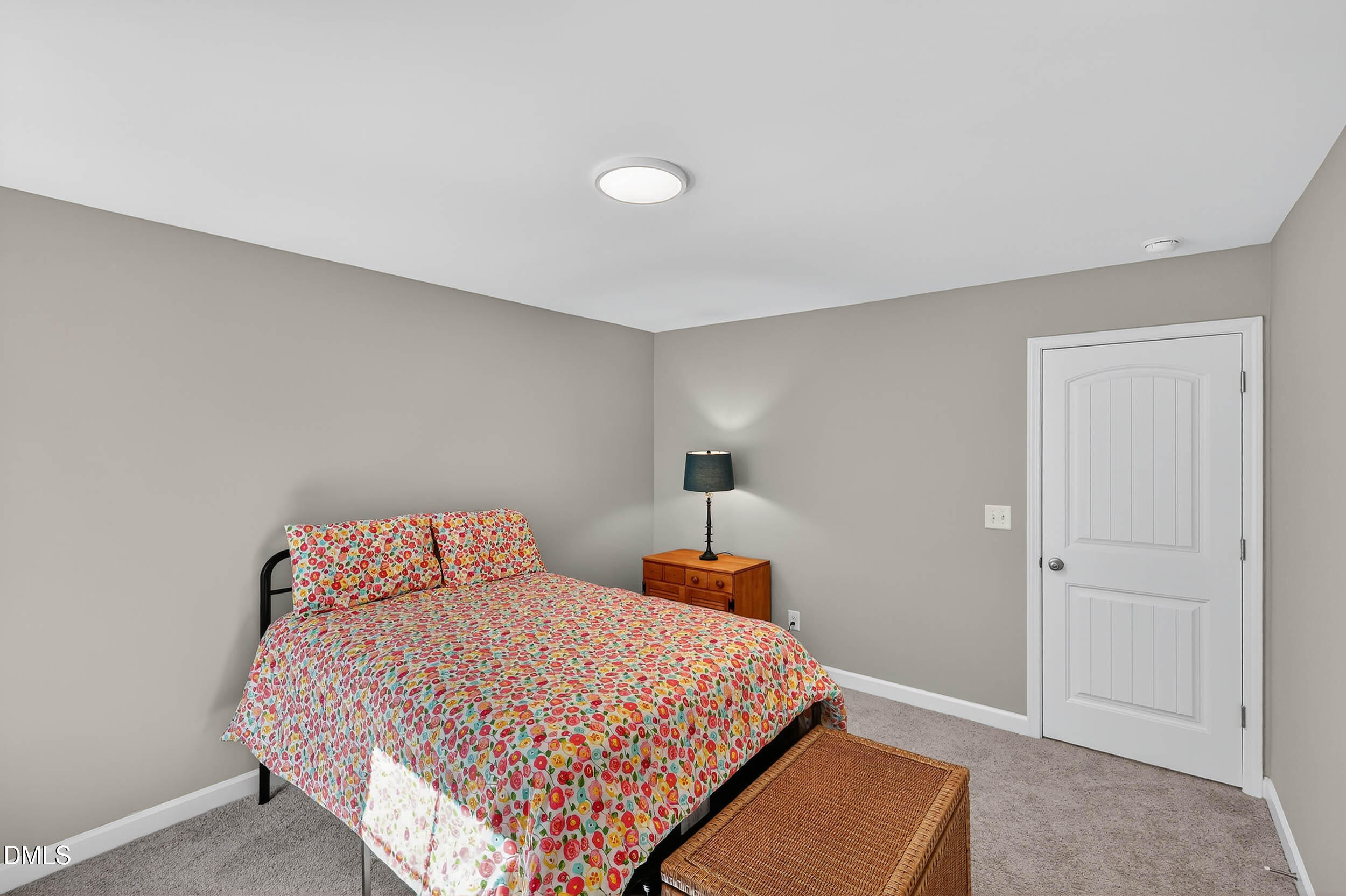 520 Husketh Road Youngsville, NC 27596 - Photo 38 of 63 a bedroom with a bed and a lamp with window