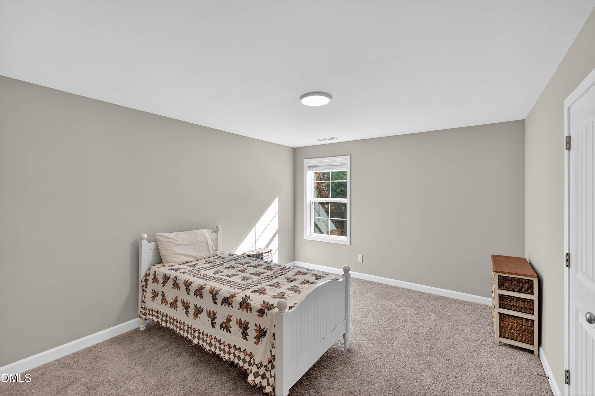 520 Husketh Road Youngsville, NC 27596 - Photo 39 of 63 a bedroom with a bed and a window