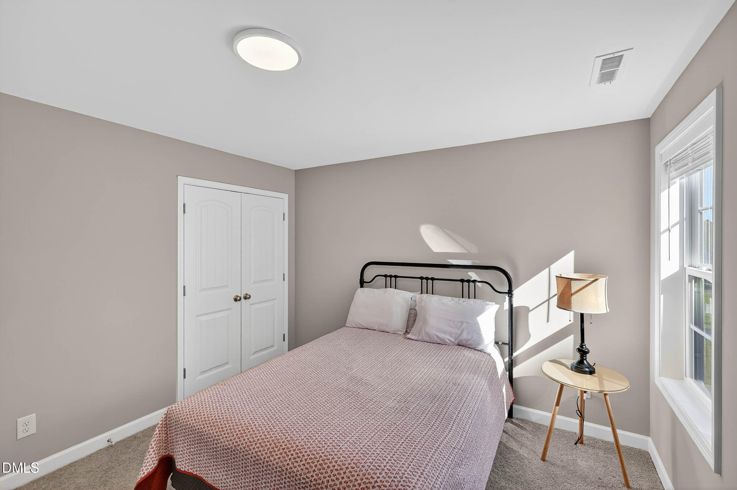 520 Husketh Road Youngsville, NC 27596 - Photo 40 of 63 a bedroom with a bed and chair