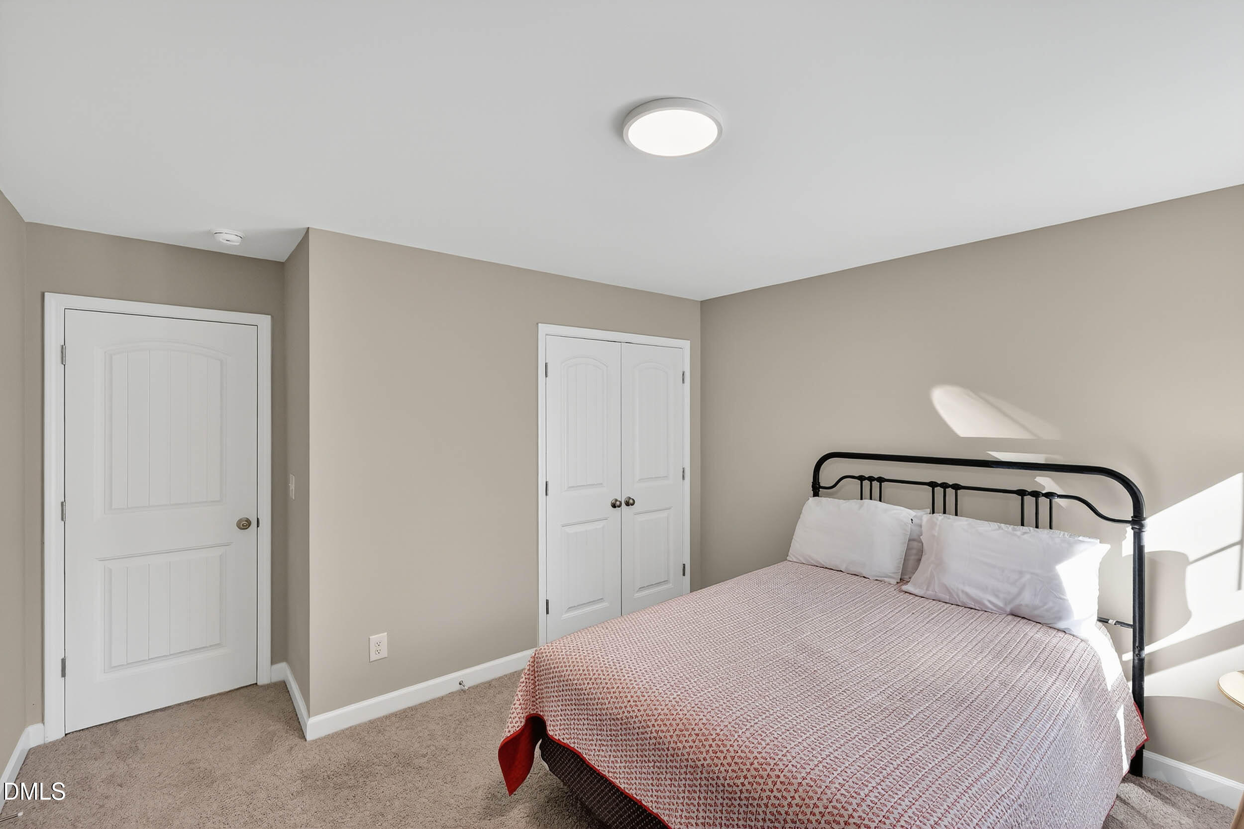 520 Husketh Road Youngsville, NC 27596 - Photo 42 of 63 a bedroom with a bed and a night stand