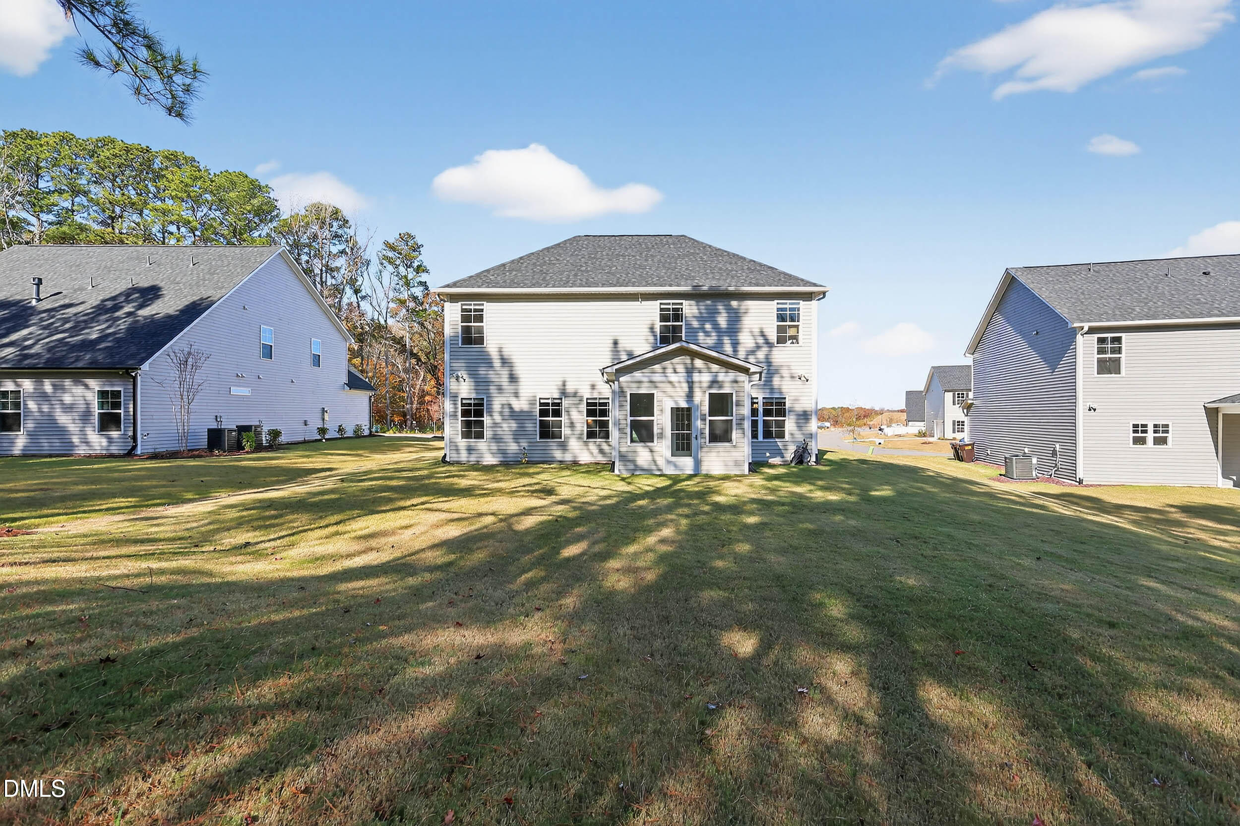 520 Husketh Road Youngsville, NC 27596 - Photo 51 of 63 a view of a house with a big yard and large trees