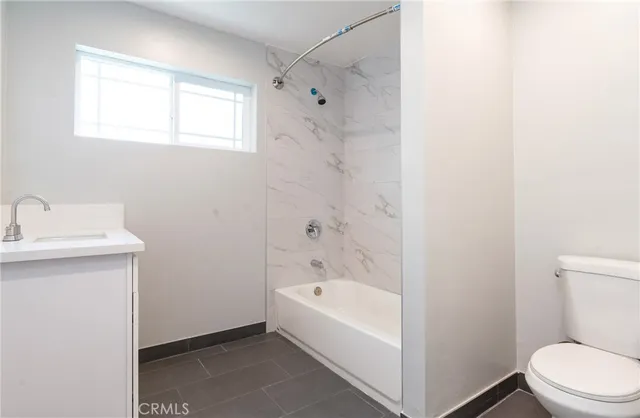 a bathroom with a bathtub and sink