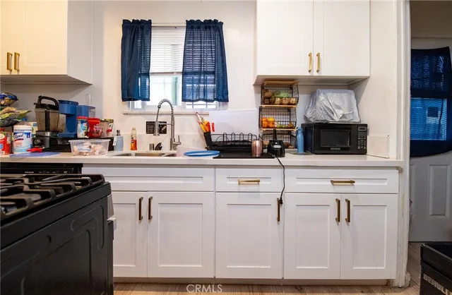 a kitchen with cabinets and appliances