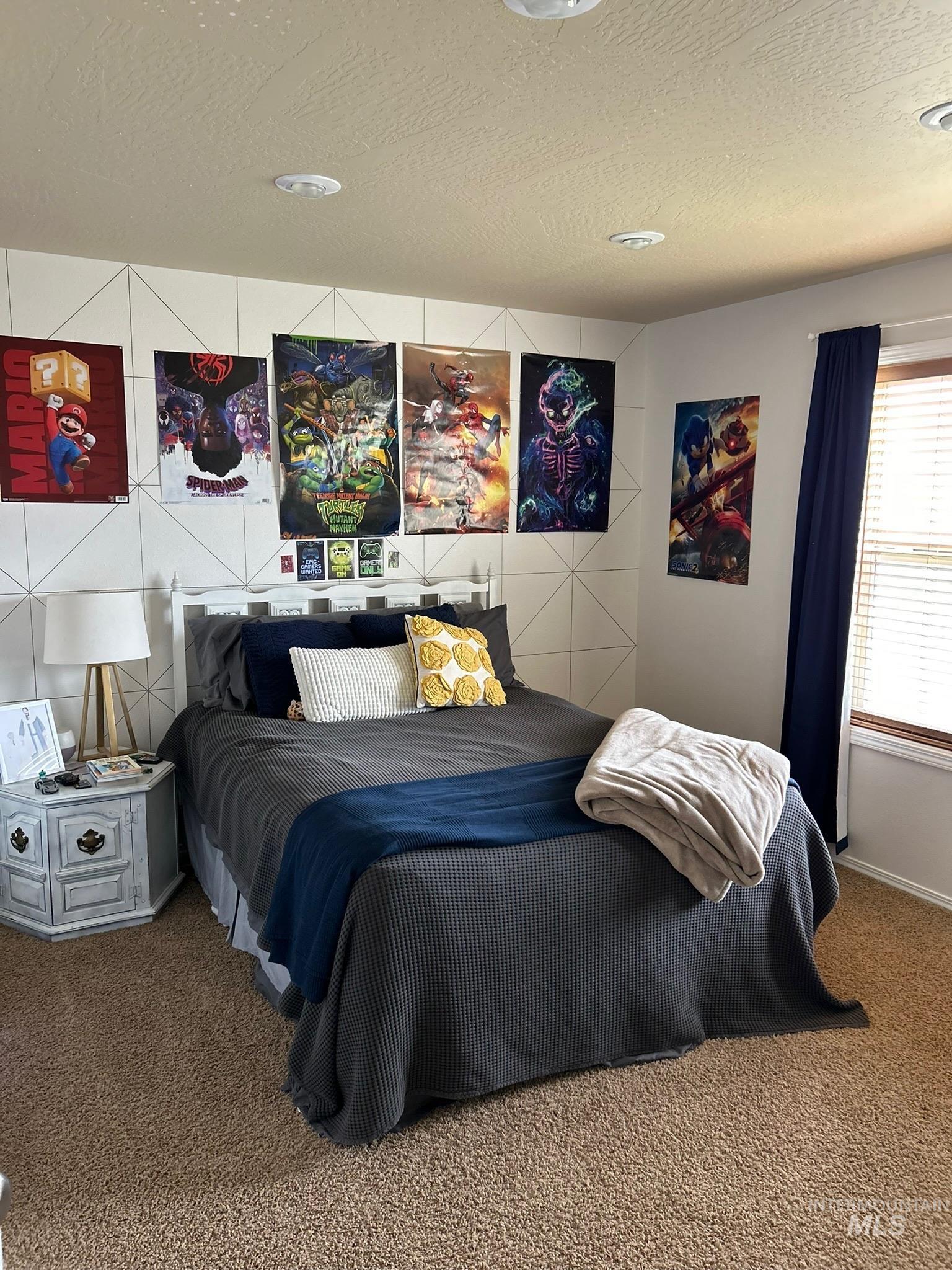 3091 Echo Road Nyssa, OR 97913 - Photo 27 of 36 Carpeted bedroom featuring a textured ceiling