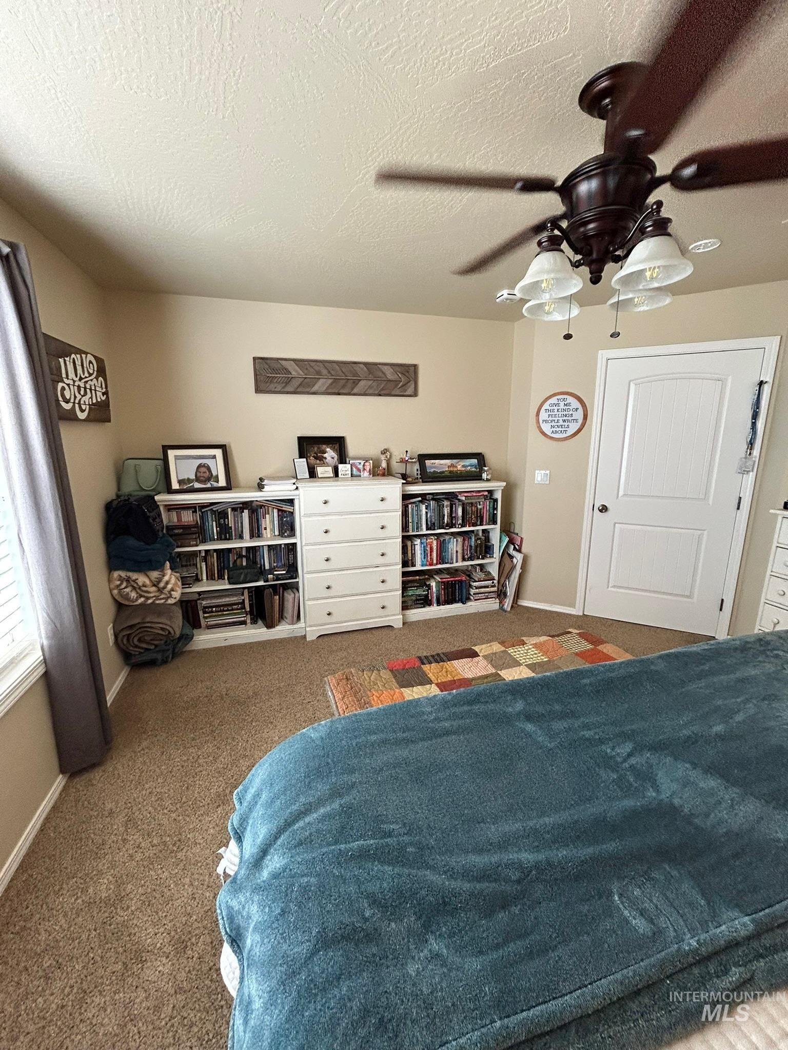 3091 Echo Road Nyssa, OR 97913 - Photo 35 of 36 Carpeted bedroom featuring a textured ceiling and a ceiling fan