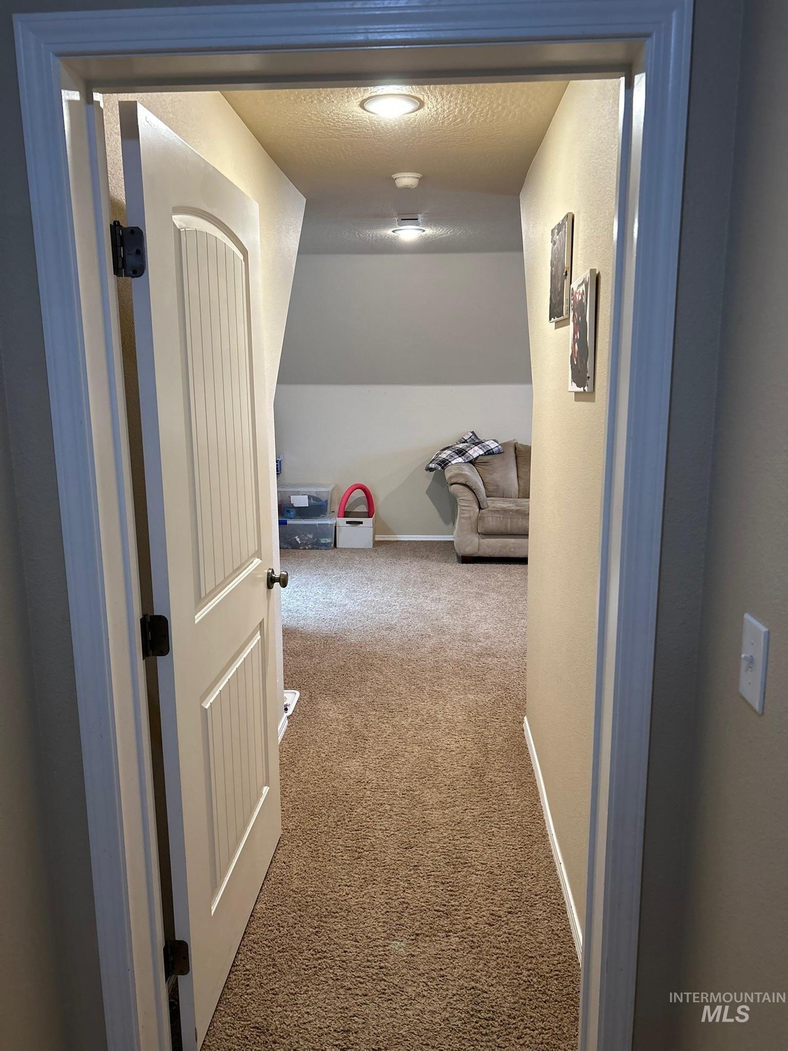 3091 Echo Road Nyssa, OR 97913 - Photo 36 of 36 Hall with carpet floors and a textured ceiling