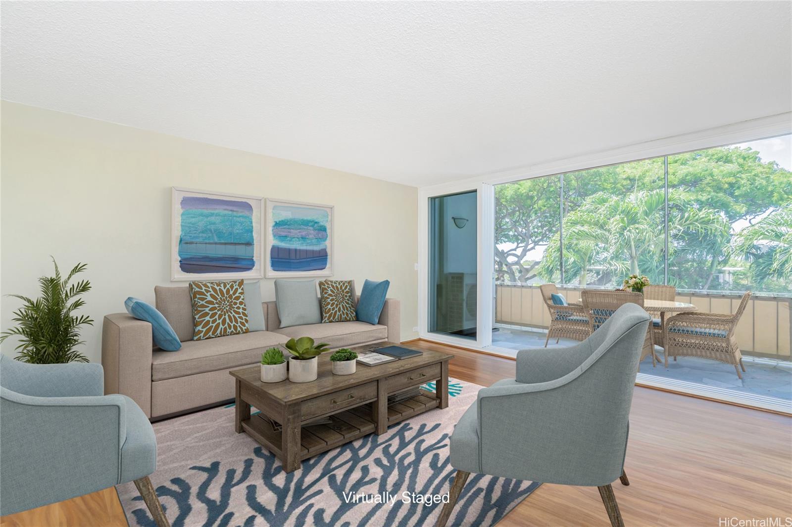 3030 Pualei Circle, Unit 308 Honolulu, HI 96815 - Photo 1 of 1 a living room with furniture and a large window