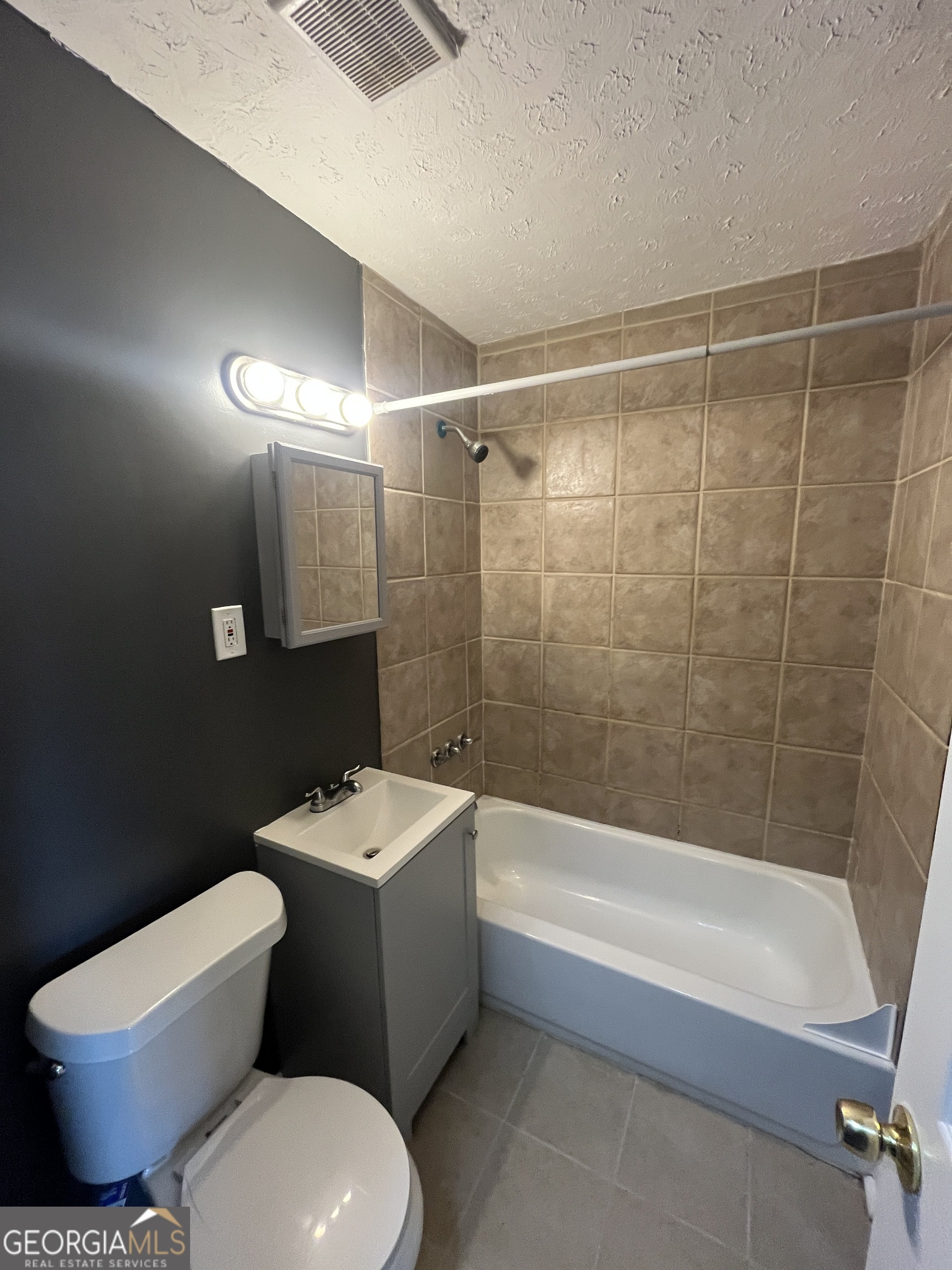 3490 Garfield Way Southeast Atlanta, GA 30354 - Photo 9 of 13 a bathroom with a toilet a sink and bathtub