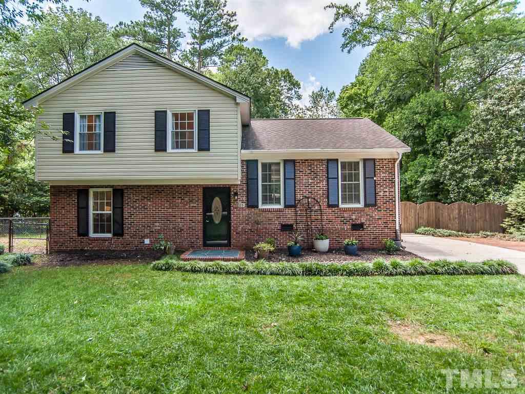 7605 Elliot Drive Raleigh, NC 27613 - Photo 22 of 22 a view of a house with a yard and a garden