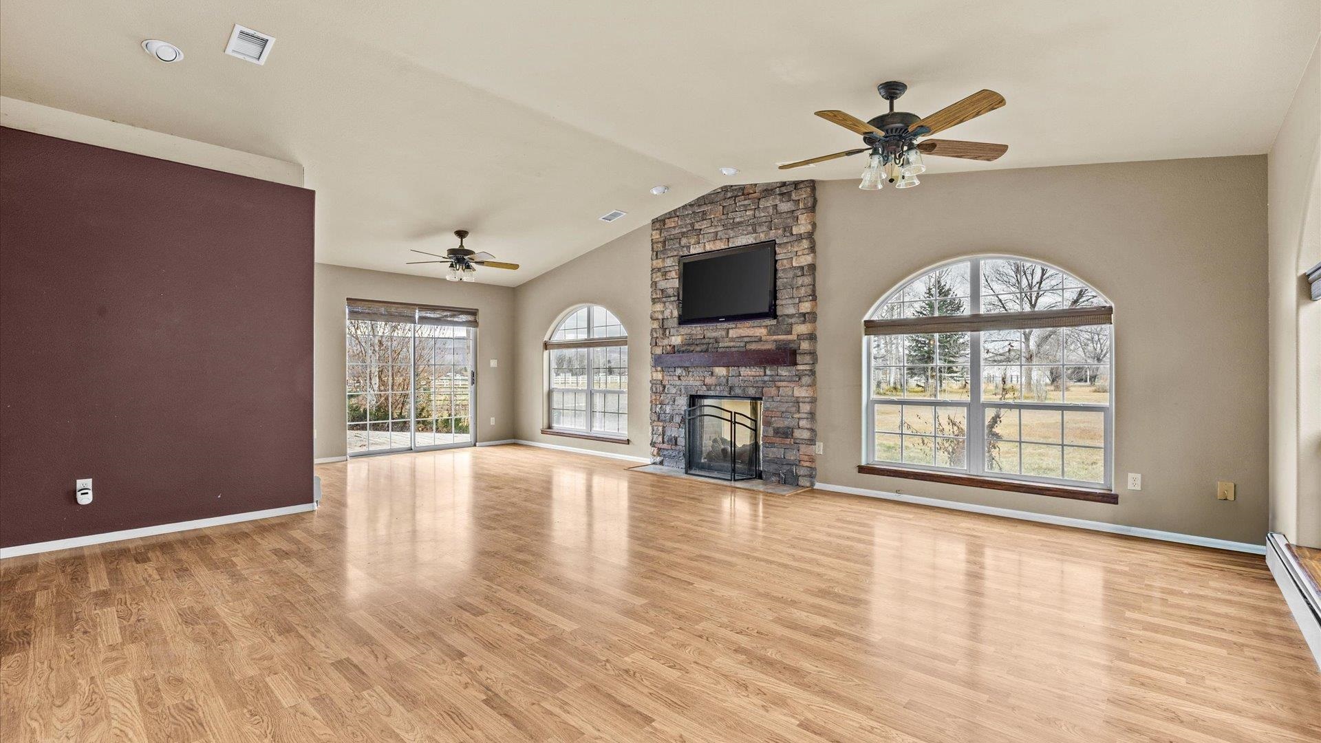 1195-17 1/2 North 1/2 Road Fruita, CO 81521 - Photo 11 of 33 a view of an empty room with a window and wooden floor