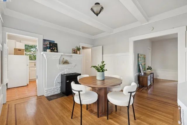 a kitchen with cabinets appliances a sink and a window