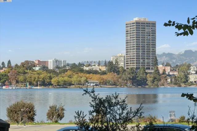 a view of staircase with lots of frames on wall