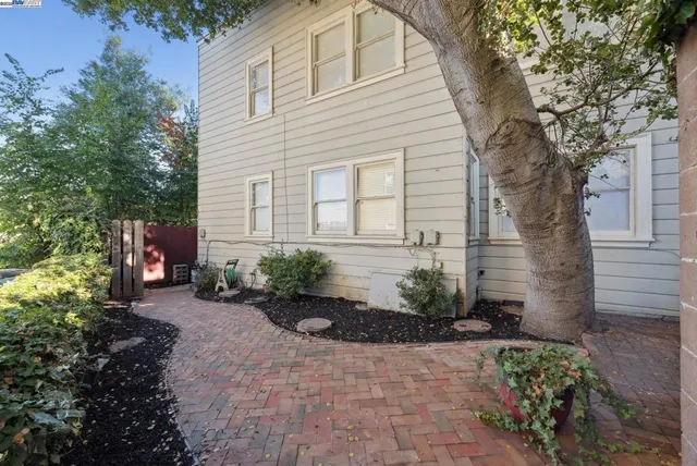 an aerial view of a house with outdoor space and lake view