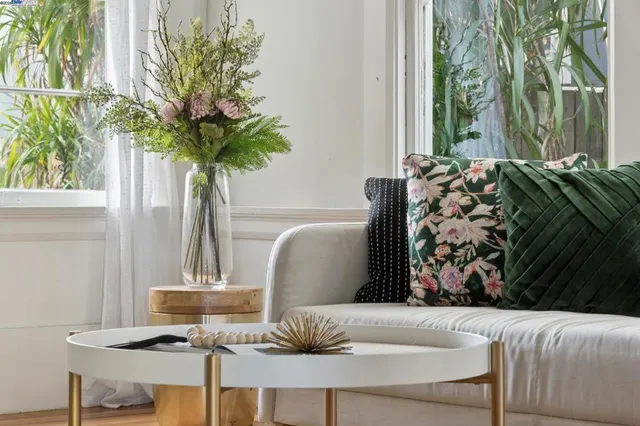 a living room with furniture and a table