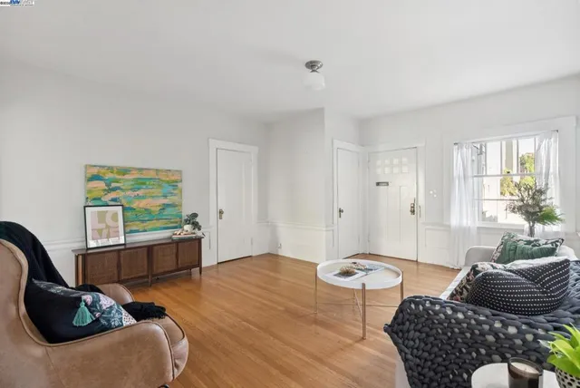 a view of a dining room with furniture and a window