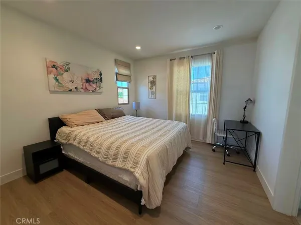a bedroom with a bed and a couch