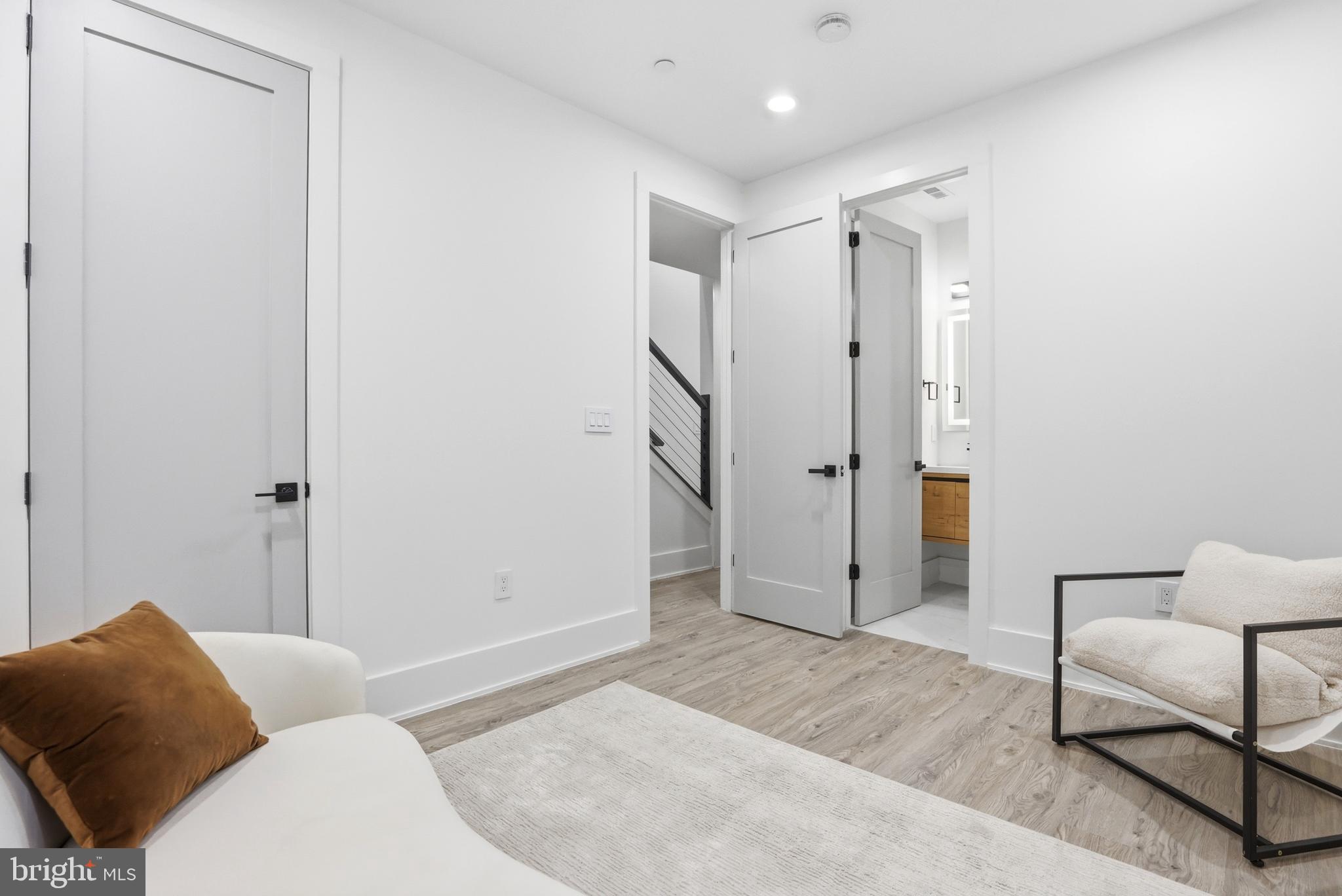 1140 Oates Street Northeast, Unit 101 Washington, DC 20002 - Photo 25 of 31 a spacious bedroom with a couch and a couch