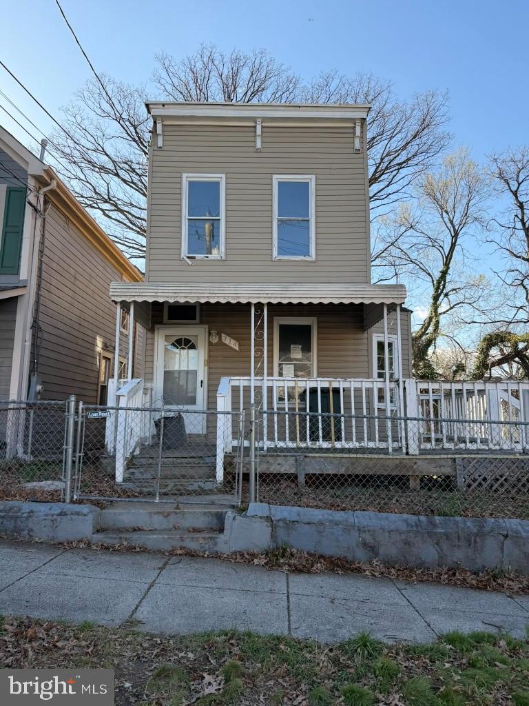 314 57th Street Northeast Washington, DC 20019 - Photo 1 of 19 a front view of a house with stairs yard