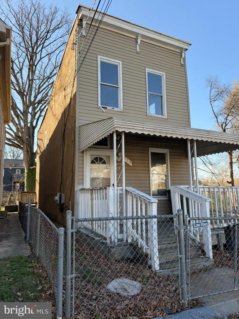 314 57th Street Northeast Washington, DC 20019 - Photo 16 of 19 a front view of a house with a porch