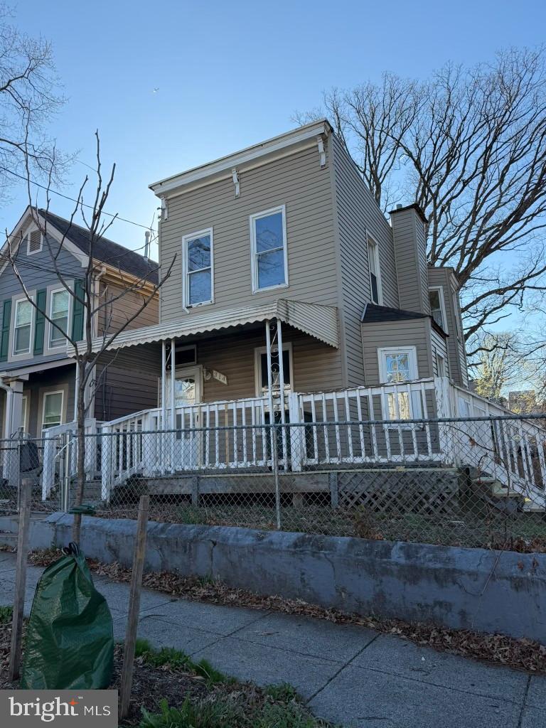 314 57th Street Northeast Washington, DC 20019 - Photo 17 of 19 a front view of a house with a yard