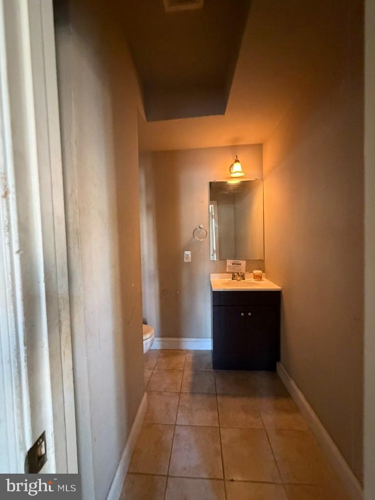 314 57th Street Northeast Washington, DC 20019 - Photo 4 of 19 a bathroom with a sink and a mirror