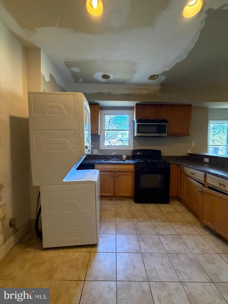 314 57th Street Northeast Washington, DC 20019 - Photo 6 of 19 a kitchen with stainless steel appliances granite countertop a stove a sink and a refrigerator