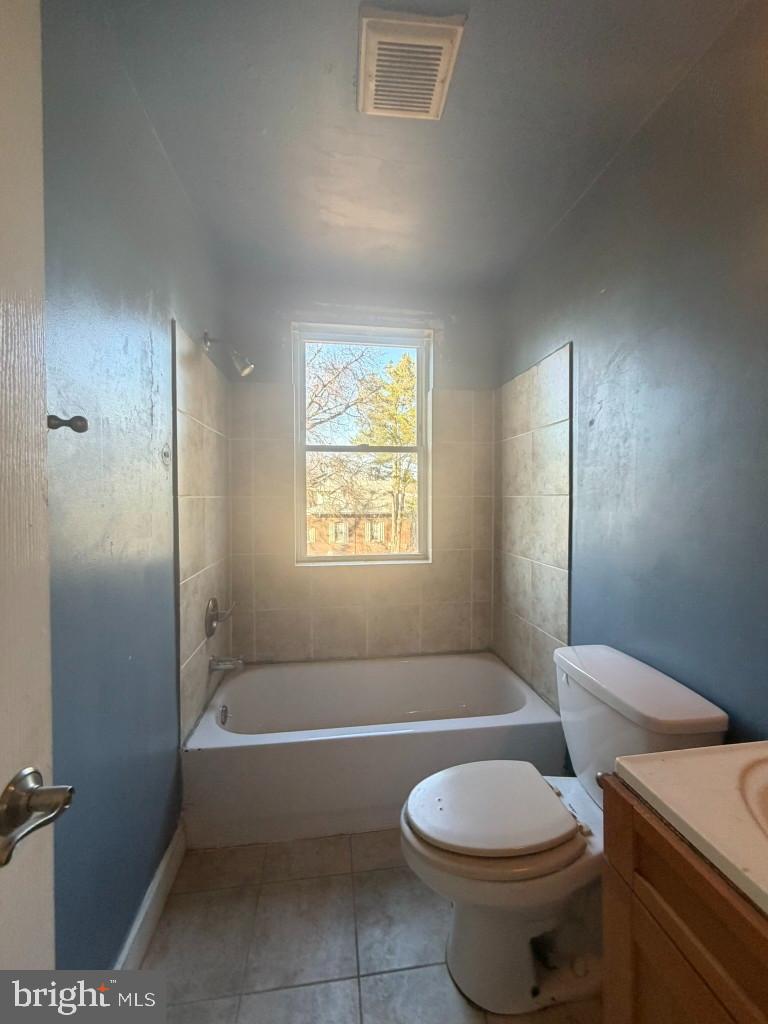 314 57th Street Northeast Washington, DC 20019 - Photo 8 of 19 a bathroom with a toilet a sink and bathtub