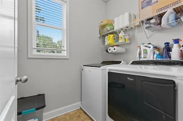 a view of a hallway with wooden floor and entryway