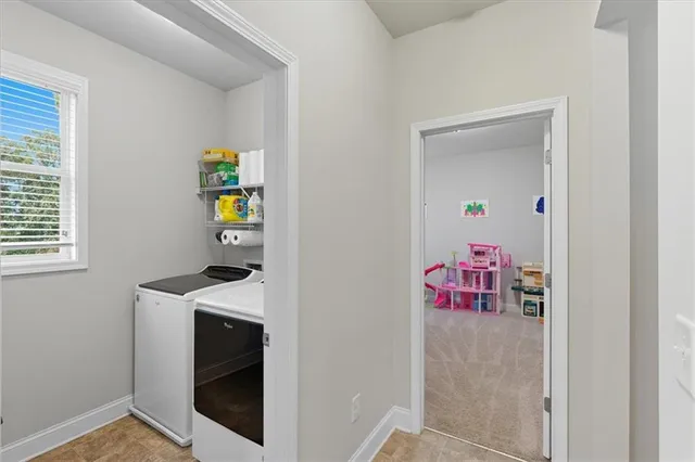 a spacious bedroom with a bed and a window