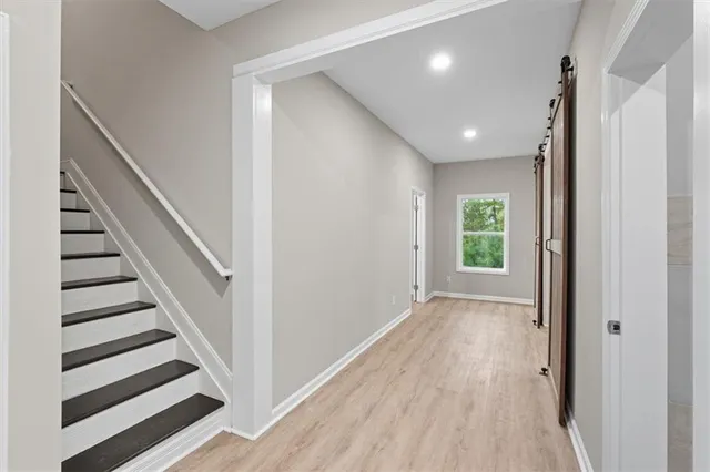a view of balcony with wooden floor and outdoor seating