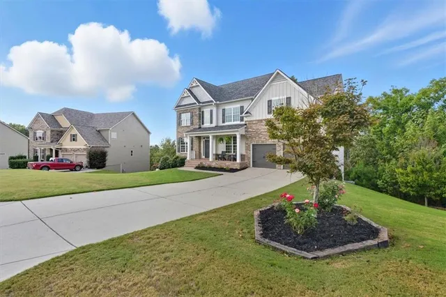 a view of a patio with table and chairs and potted plants