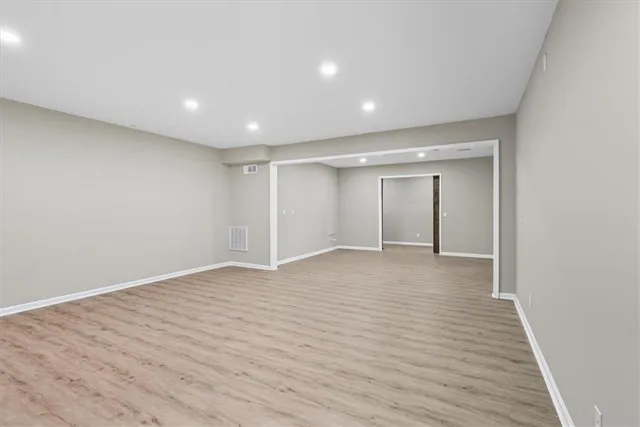 a view of a deck with wooden floor and outdoor seating